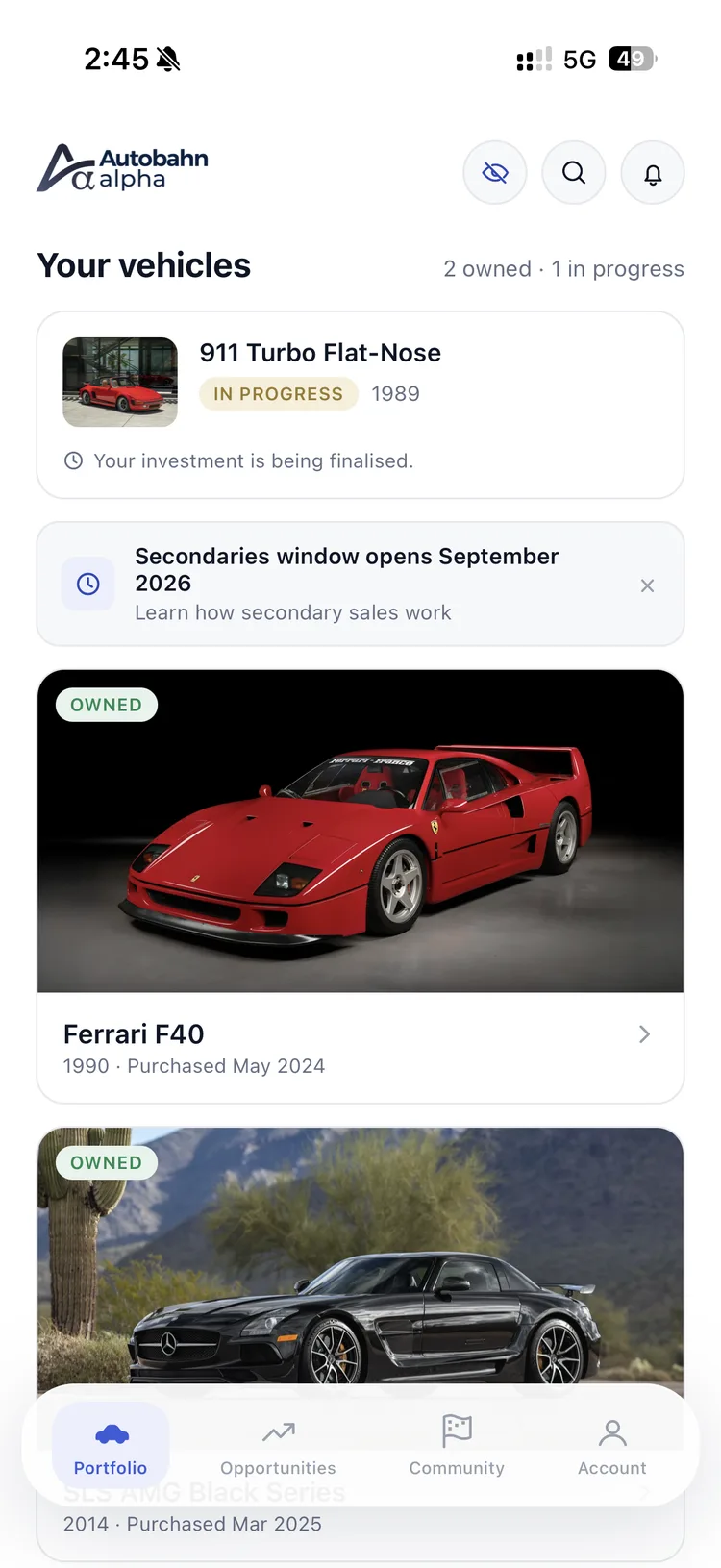 The Portfolio tab — your vehicles, with owned cars and one in progress